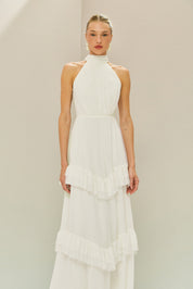 Vestido Longo em Tule com Gola Alta, Costas Abertas com Aplicação de Renda Guipir e Saia em Camadas com Babados - Mons Off White
