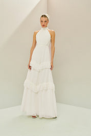 Vestido Longo em Tule com Gola Alta, Costas Abertas com Aplicação de Renda Guipir e Saia em Camadas com Babados - Mons Off White