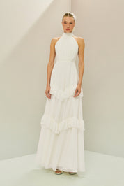 Vestido Longo em Tule com Gola Alta, Costas Abertas com Aplicação de Renda Guipir e Saia em Camadas com Babados - Mons Off White